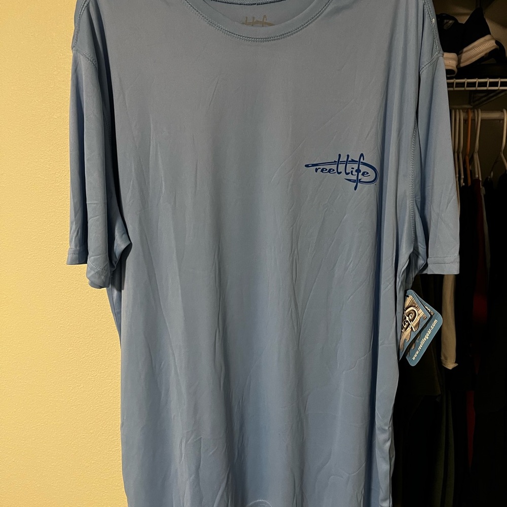 Reel Life shirt with tags still on it.